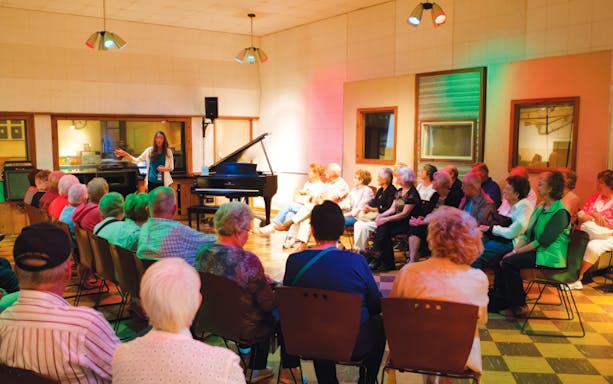 Visitors attending a presentation at the Country Music Hall of Fame and Museum.