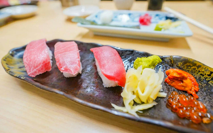 Sushi assortment with wasabi and pickled ginger at Tsukiji Fish Market, Tokyo.