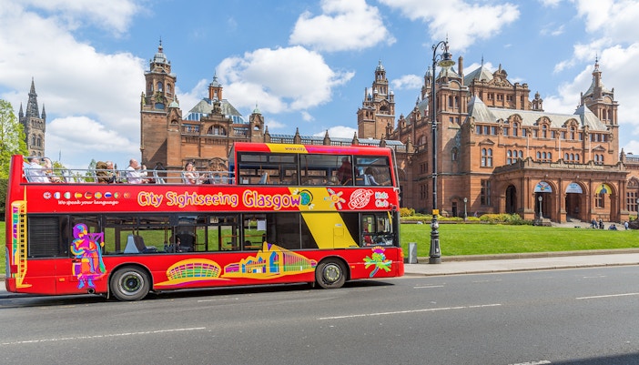 City Sightseeing Glasgow bus in front of Kelvingrove Art Gallery and Museum.