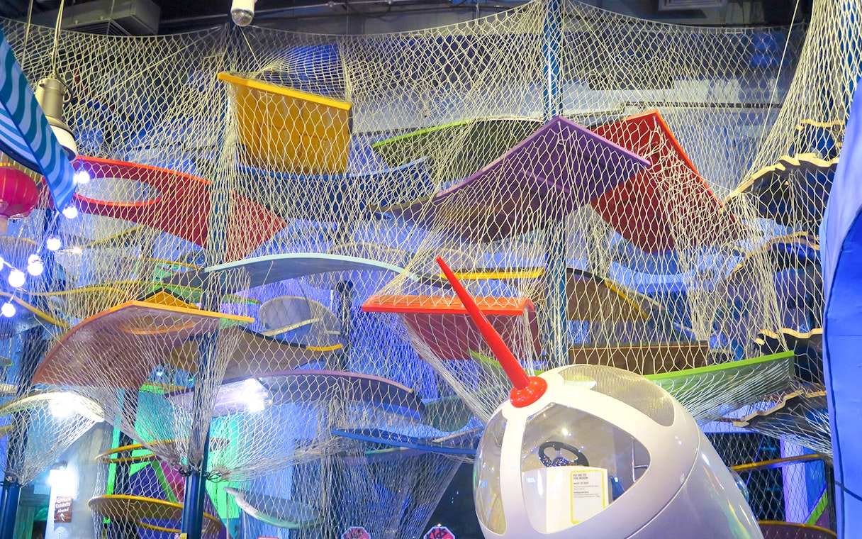 Colorful climbing structure at KidsSTOP Singapore.