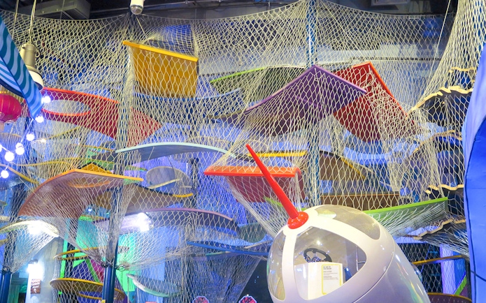 Colorful climbing structure at KidsSTOP Singapore.