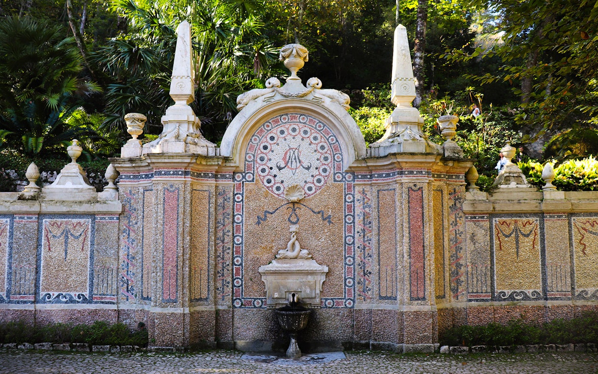 Quinta da Regaleira ornate stone fountain in Sintra, Portugal.