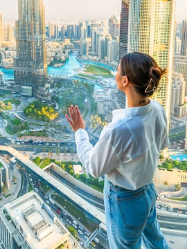 Person enjoying cityscape view from Sky Views Edge Walk in Dubai.