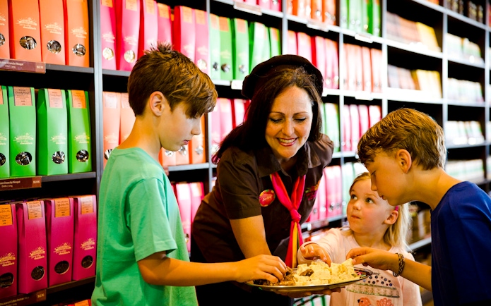 Children sampling chocolates with a guide at Yarra Valley Chocolaterie Ice-Creamery.