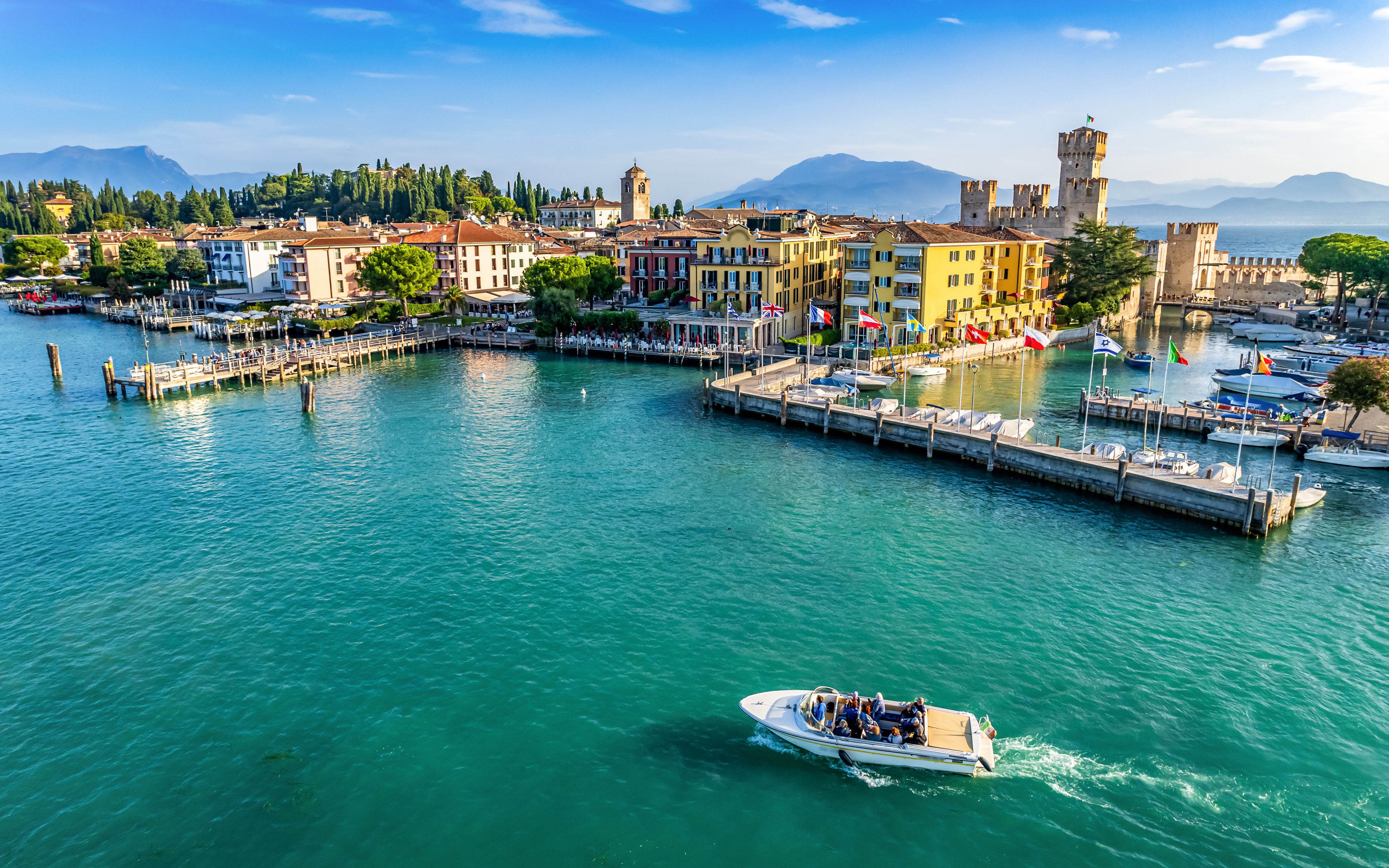 Aerial view of Sirmione with Scaliger Castle and boats on Lake Garda, Italy.