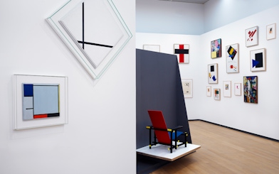 Abstract art and De Stijl chair inside Stedelijk Museum, Amsterdam.