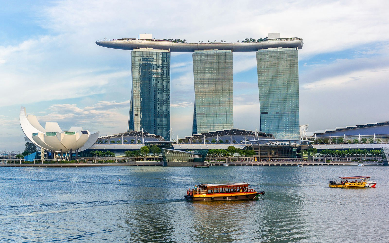 Marina Bay Sands with river ferry in the foreground inSingapore.