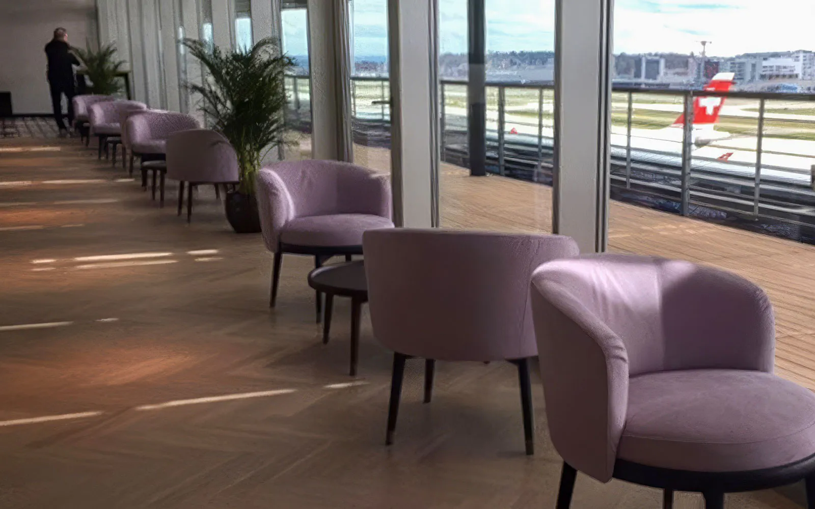 Aspire SKY Lounge seating area with airport view at Zurich Airport Terminal E.