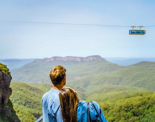 Couple looking at the Scenic Skyway ride in Scenic World, Blue Mountains
