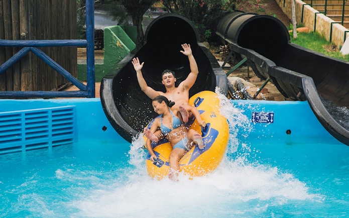 Visitors enjoying a water slide at Aqualandia Benidorm.