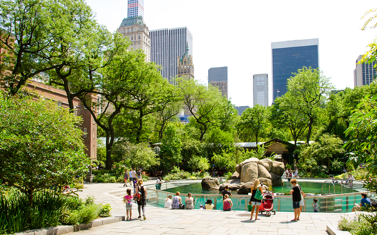 Visitors at the sea lion exhibit in Central Park Zoo, New York City.