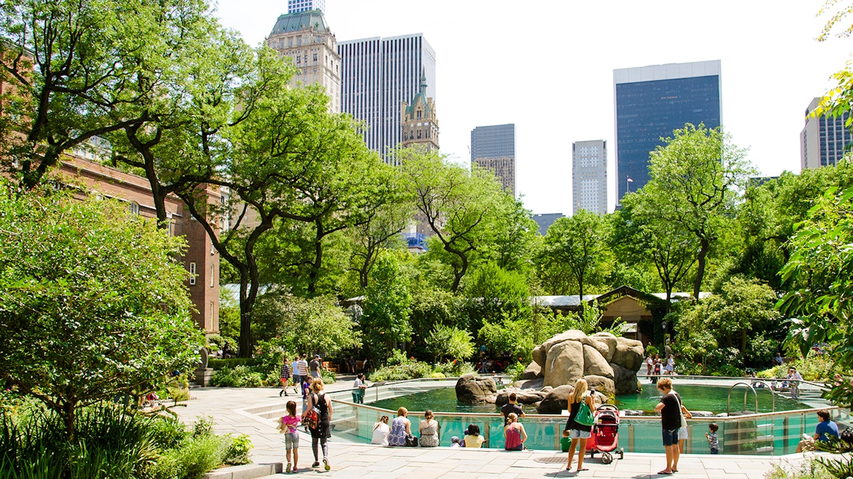 Visitors at the sea lion exhibit in Central Park Zoo, New York City.