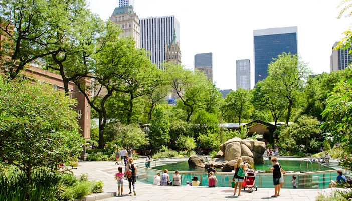 Visitors at the sea lion exhibit in Central Park Zoo, New York City.