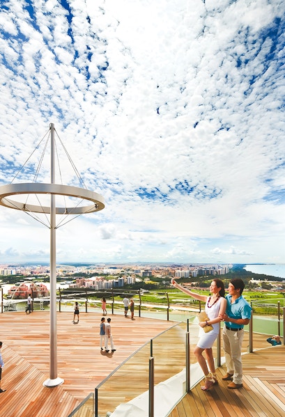 Visitors enjoying the view from Marina Bay Sands Sky Park in Singapore.