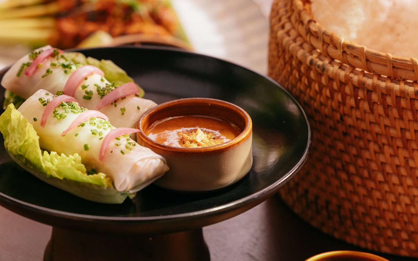 Rice paper rolls with pickled onions and dipping sauce at Andaliman brunch, Dubai.