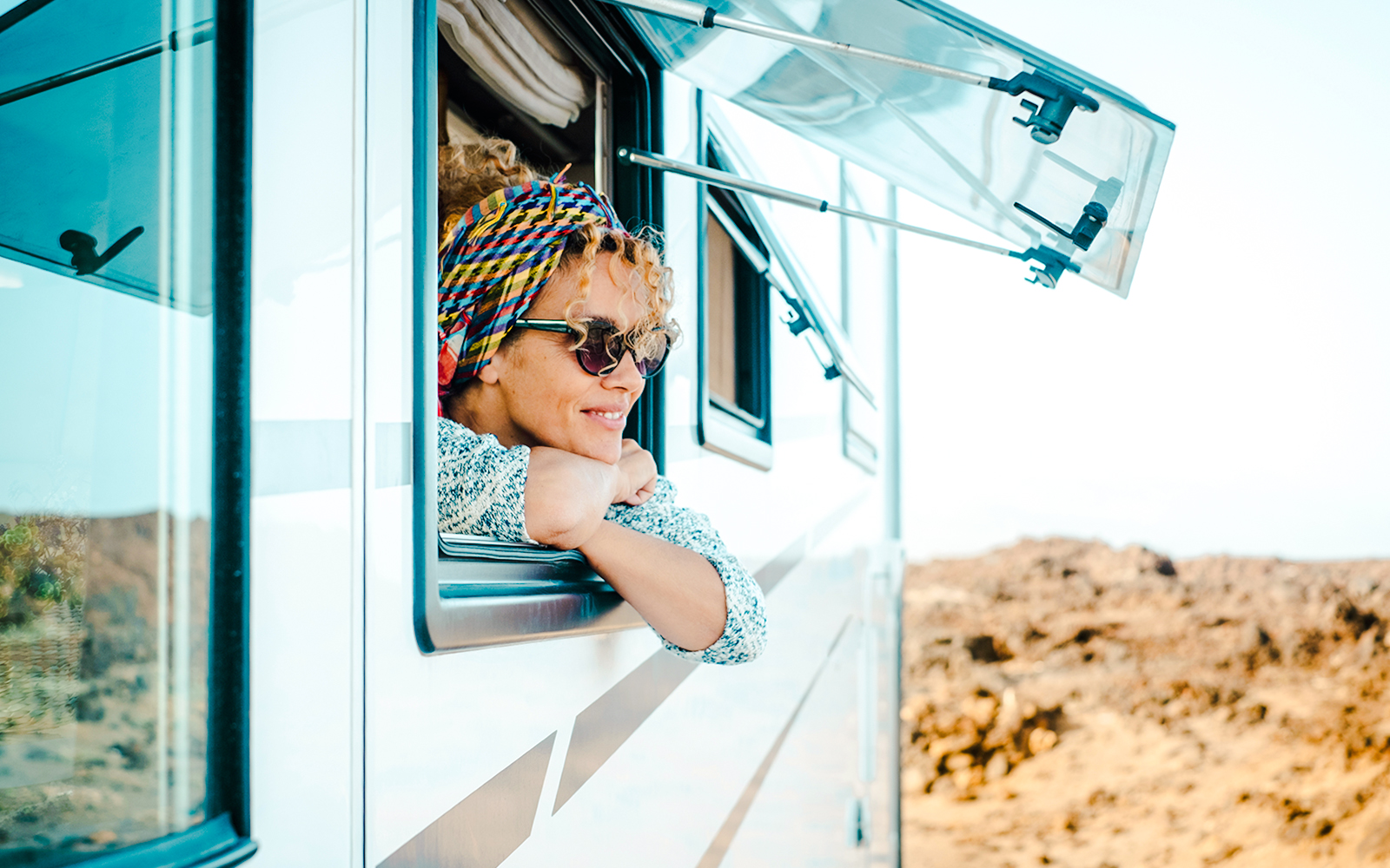 Woman peeping out of an RV window