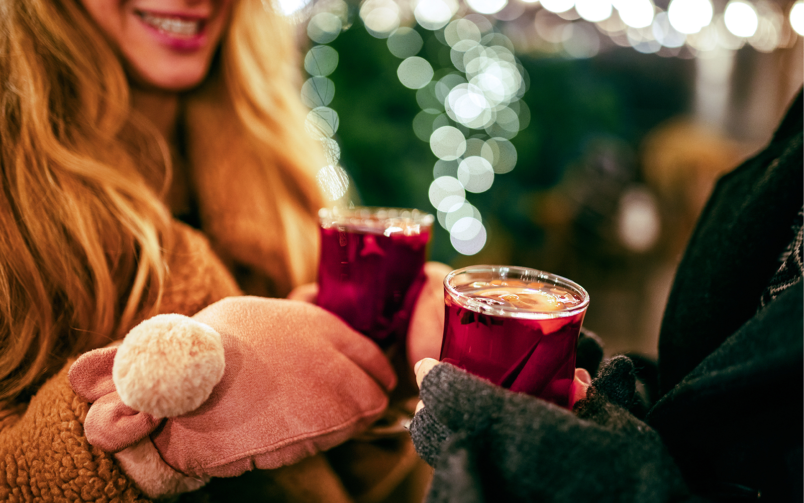 Mulled wine being enjoyed at a festive market in Paris.