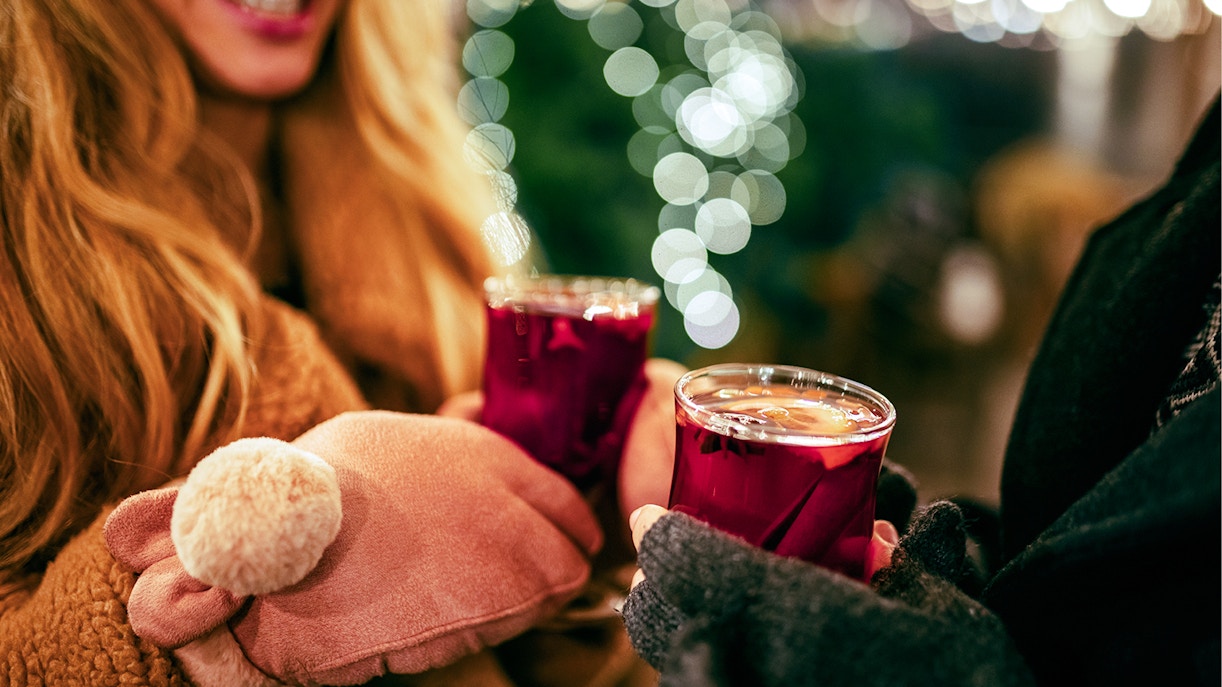 Mulled wine being enjoyed at a festive market in Paris.
