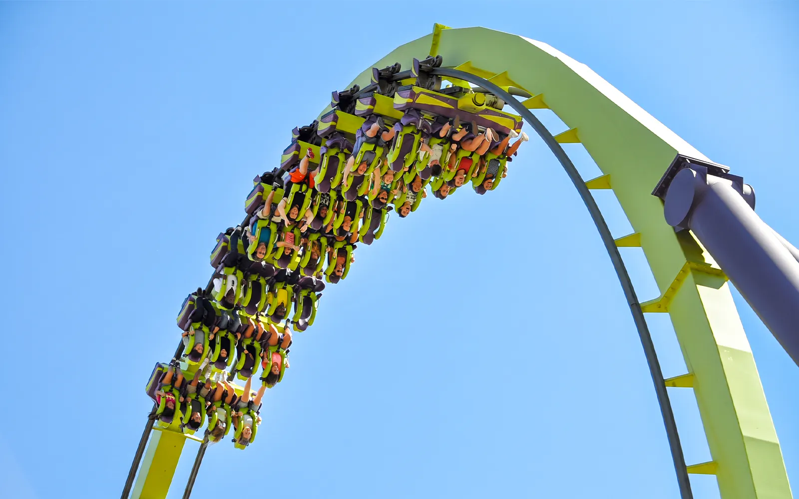 Roller coaster riders upside down on Medusa at Six Flags Discovery Kingdom, California.
