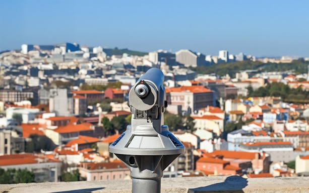 Telescope overlooking Lisbon from Church of Graca viewpoint.