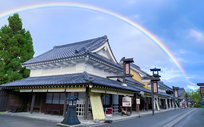 Noboribetsu Date Jidaimura traditional buildings under a rainbow in Hokkaido, Japan.
