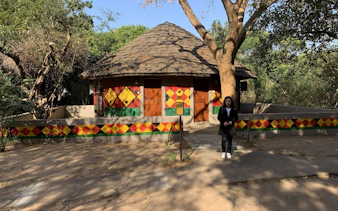 Traditional Zulu hut with colorful geometric patterns in Durban, South Africa.
