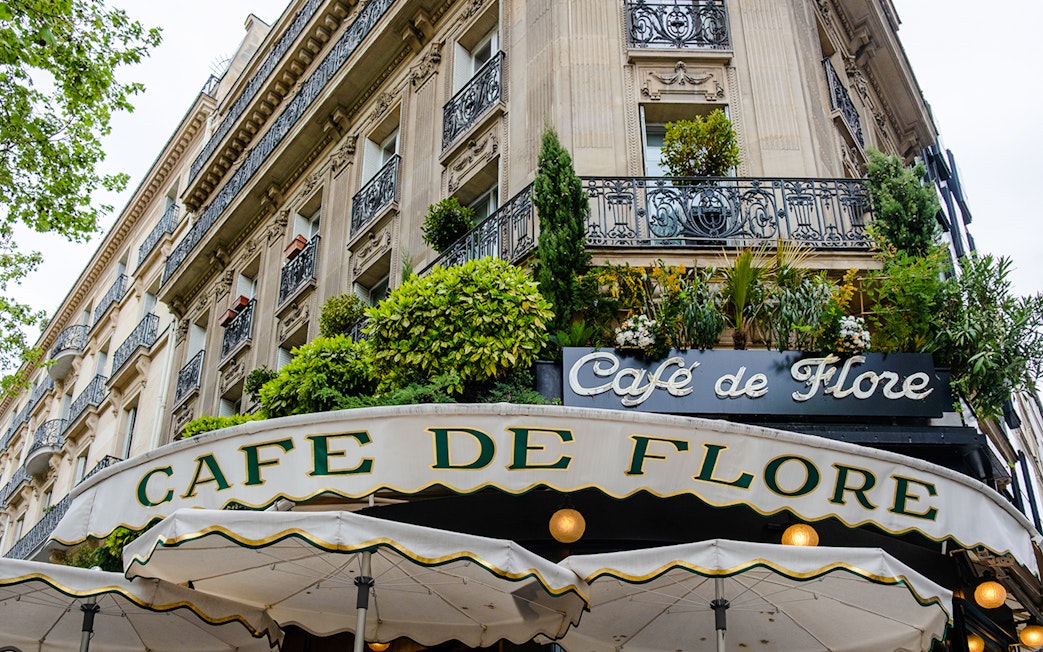 Cafe de Flore exterior with greenery, Paris, featured in Emily in Paris Food Tour.