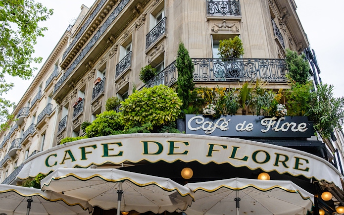 Cafe de Flore exterior with greenery, Paris, featured in Emily in Paris Food Tour.