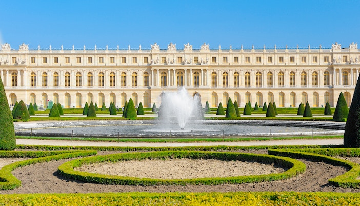 Palace of Versailles front view with fountain, France.