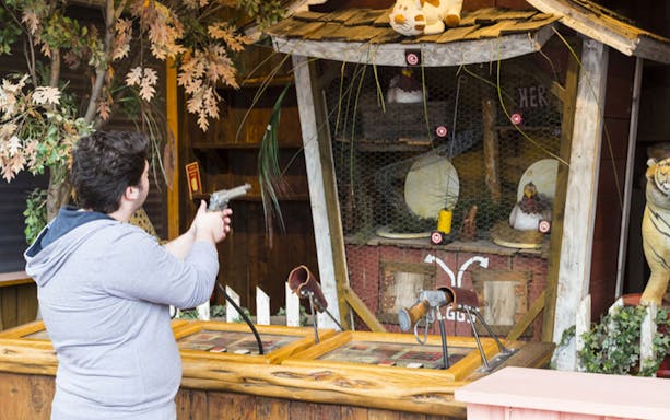 Visitor playing shooting game at Vialand Theme Park.
