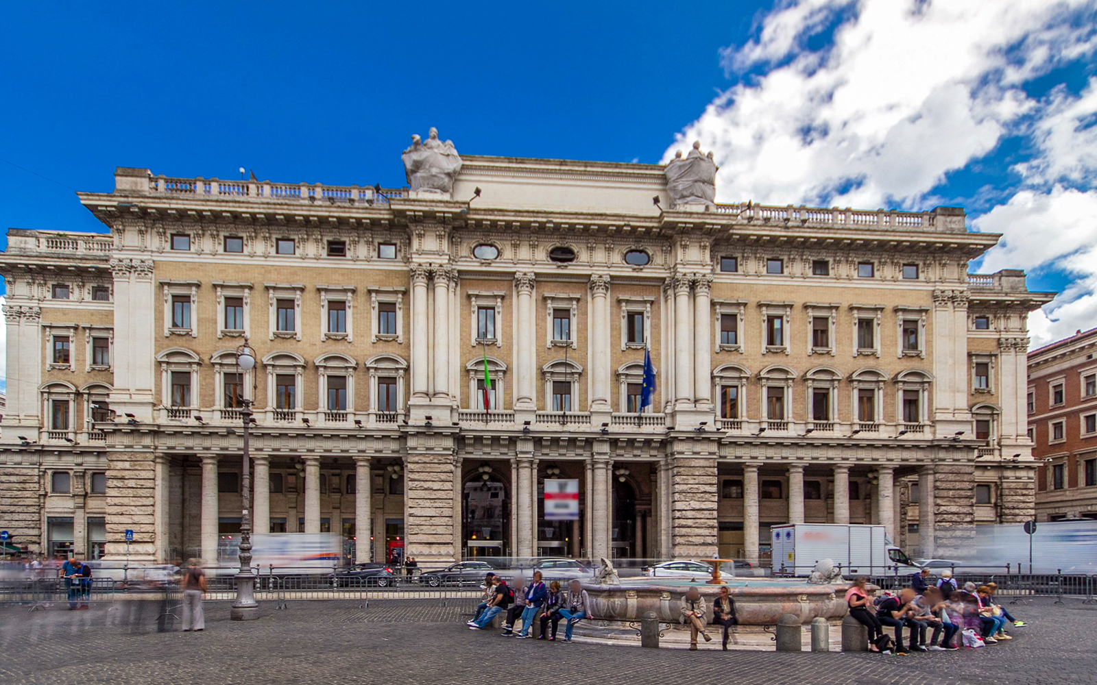 exterior view of Galleria Alberto Sordi with shoppers in Rome, Italy.