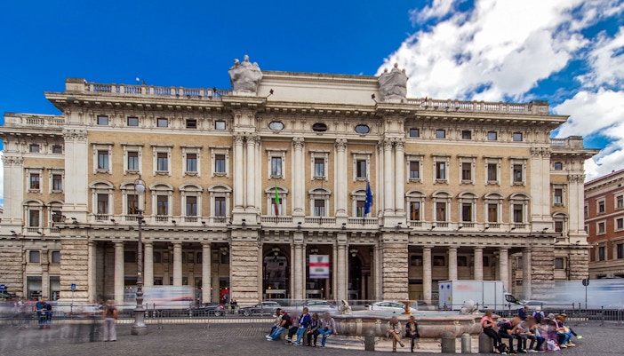 exterior view of Galleria Alberto Sordi with shoppers in Rome, Italy.