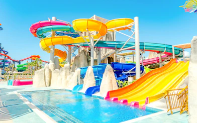 Colorful water slides at The Land Of Legends Theme Park's waterfly ride.