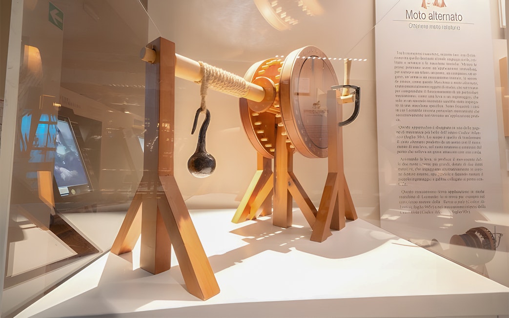 Artifact display at Leonardo3 Museum, Milan featuring a mechanical model.