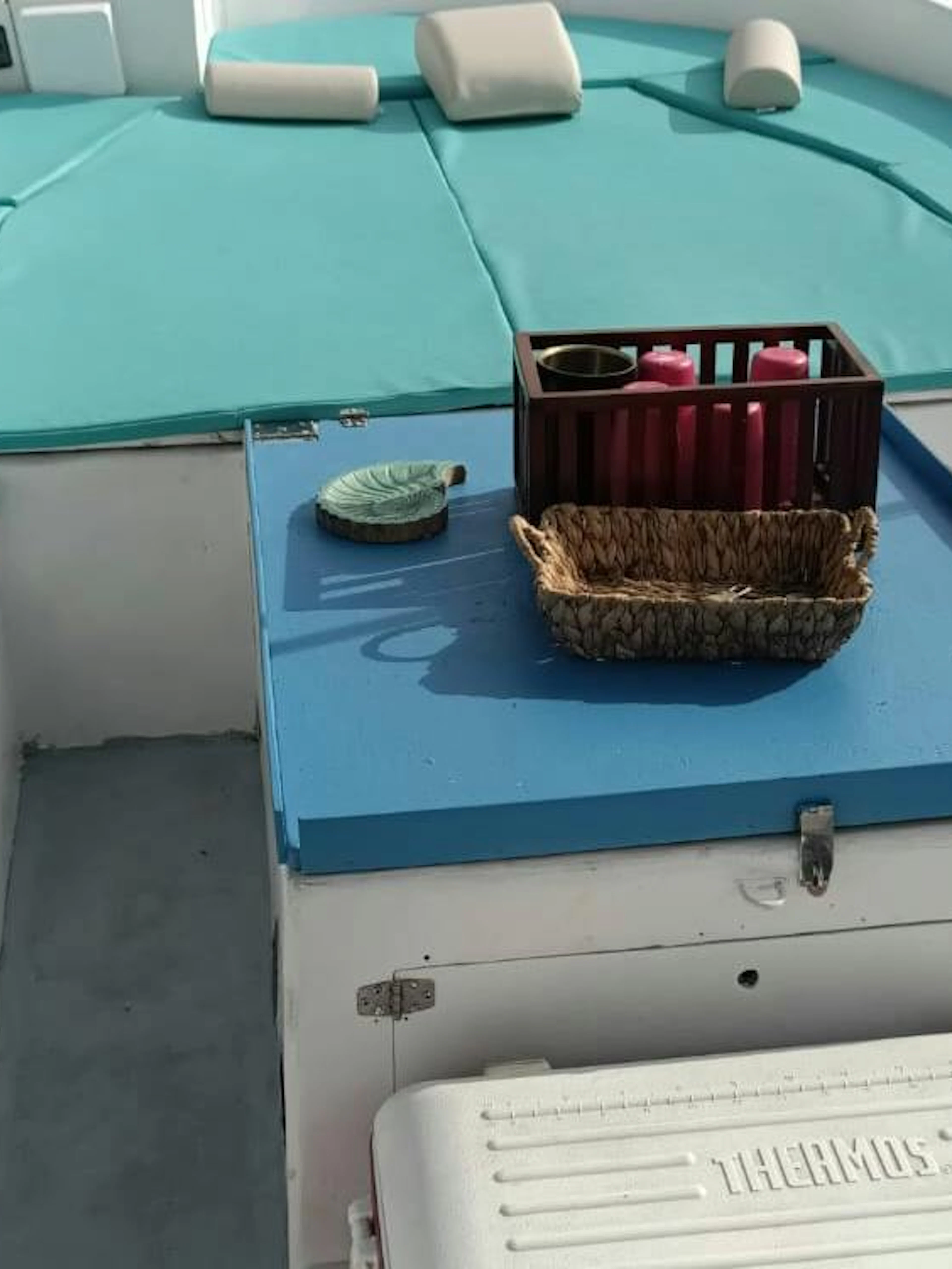 Boat deck with seating and a basket, part of Naples Sunset Boat Tour along Posillipo Coast.