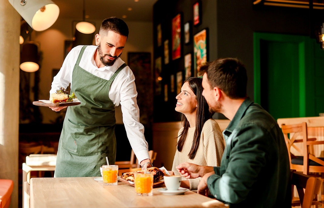 cafe barista with visitors