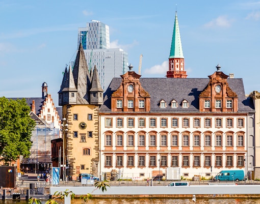 Exterior view of Historical Museum Frankfurt with clock tower and spire.