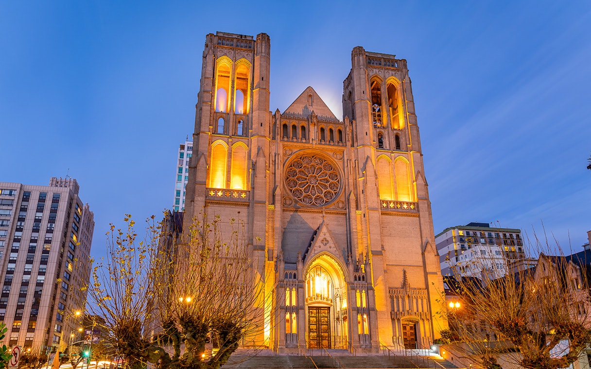 Grace Cathedral illuminated at sunset during Big Bus 1-Hr Sunset Tour in San Francisco.