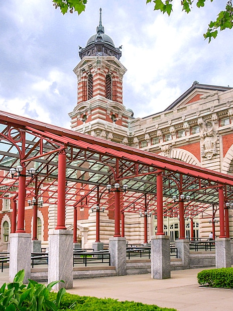 Ellis Island Immigration Museum entrance with red canopy and historic architecture.