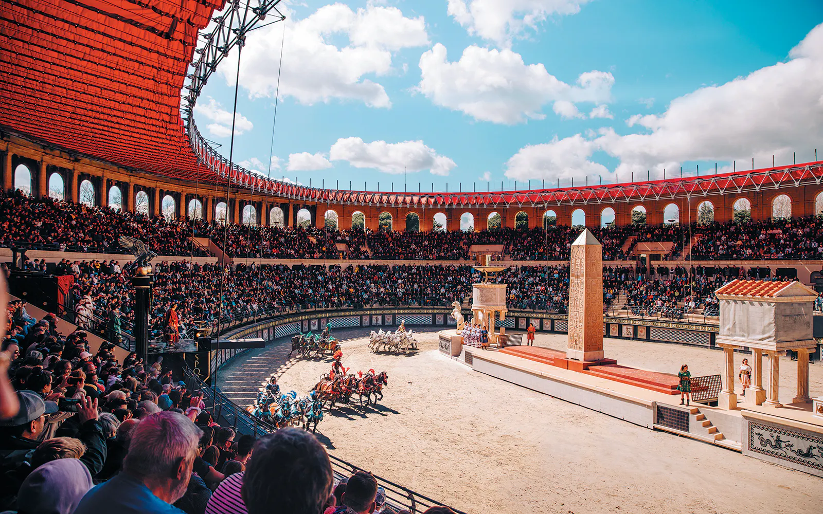 Chariot race in a packed arena at Puy Du Fou show, France.