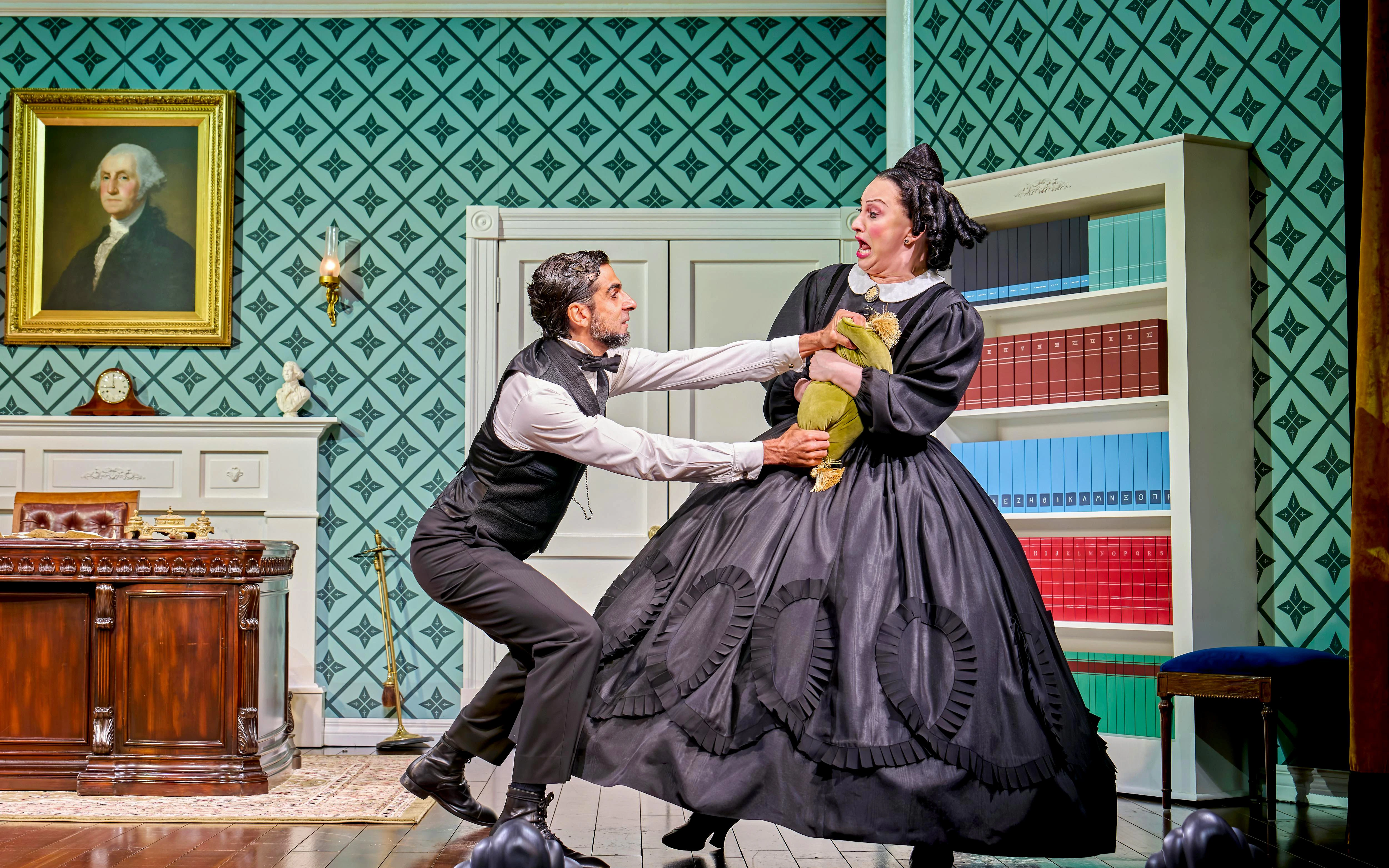Man and woman in period costumes in a dramatic scene from "Oh Mary!" play.