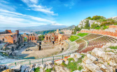 Ancient Greek Theatre in Taormina with Mount Etna view, part of Messina shore excursion.