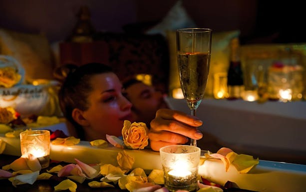 Champagne and candles in a relaxing bath at Mandala Day Spa.
