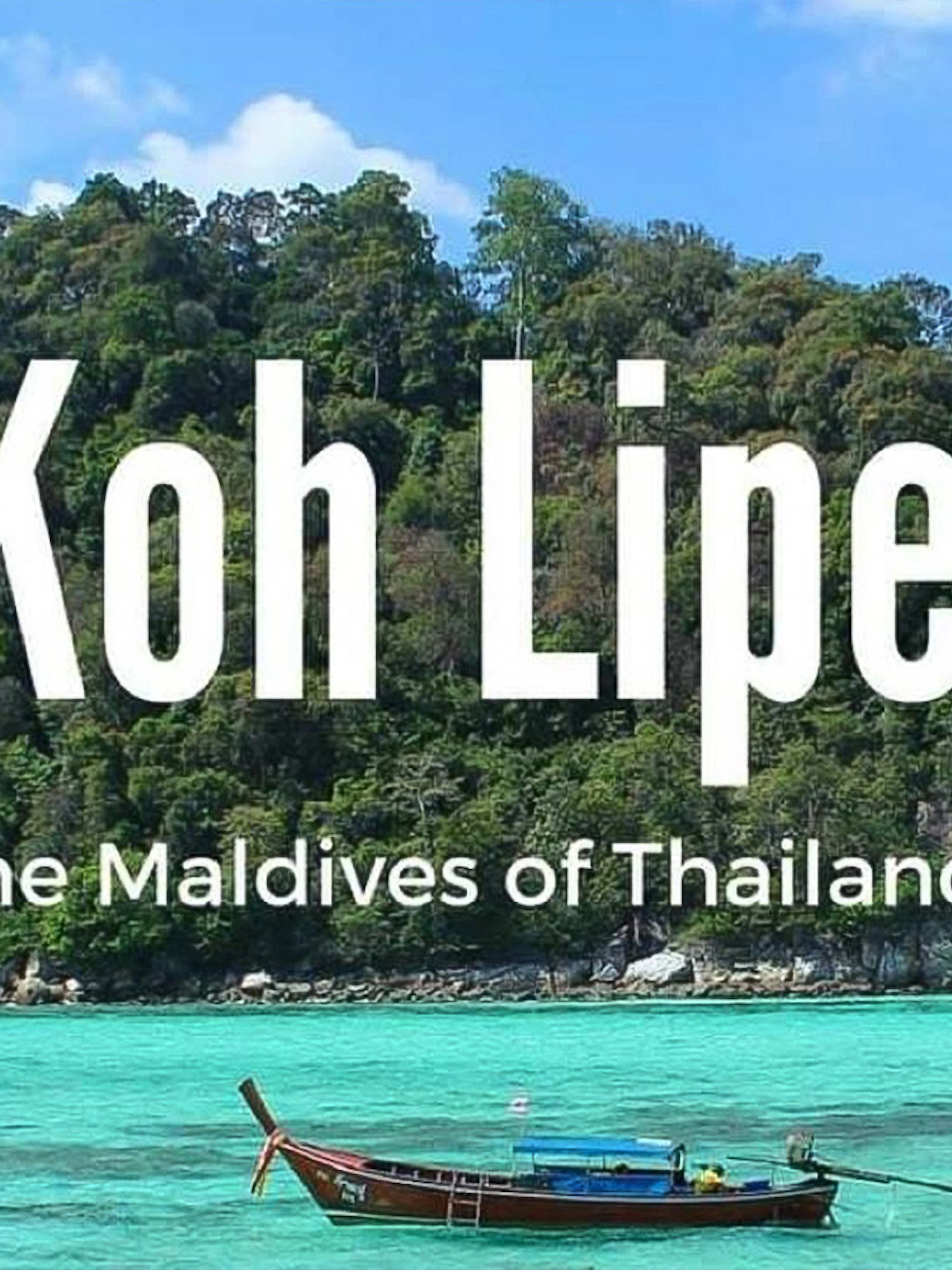 Ferry near lush island of Koh Lipe, Thailand, with turquoise waters.