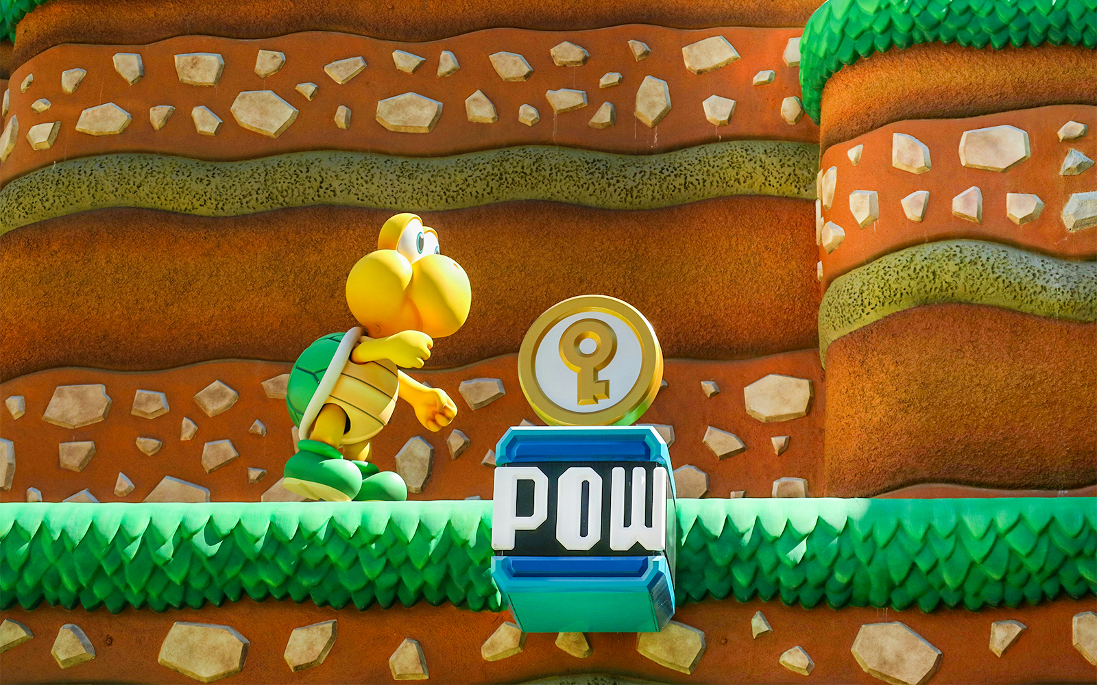 Koopa Troopa character and POW block at Super Mario World, Universal Orlando, Florida.