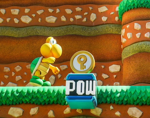 Koopa Troopa character and POW block at Super Mario World, Universal Orlando, Florida.