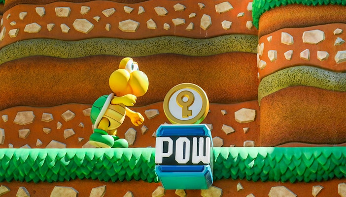 Koopa Troopa character and POW block at Super Mario World, Universal Orlando, Florida.