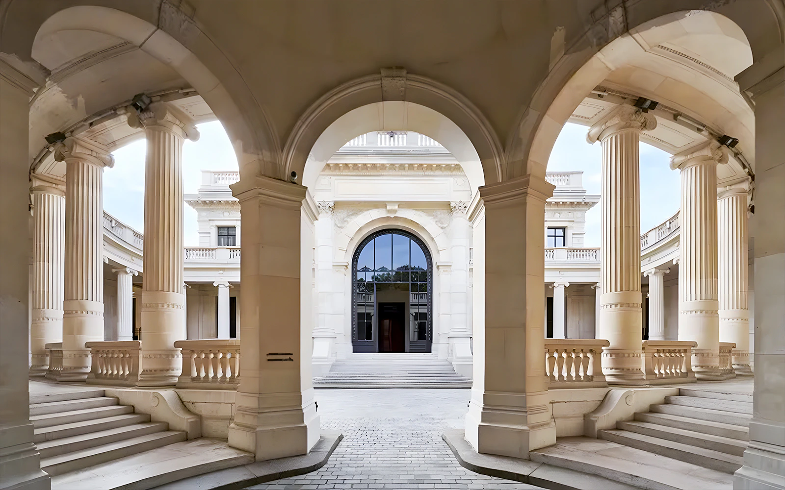 Palais Galliera corridors with arched architecture and columns in Paris.