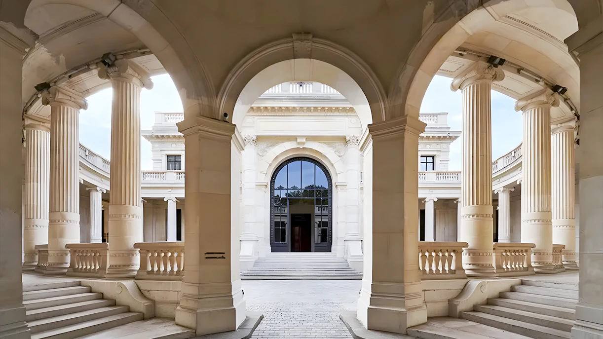 Palais Galliera corridors with arched architecture and columns in Paris.