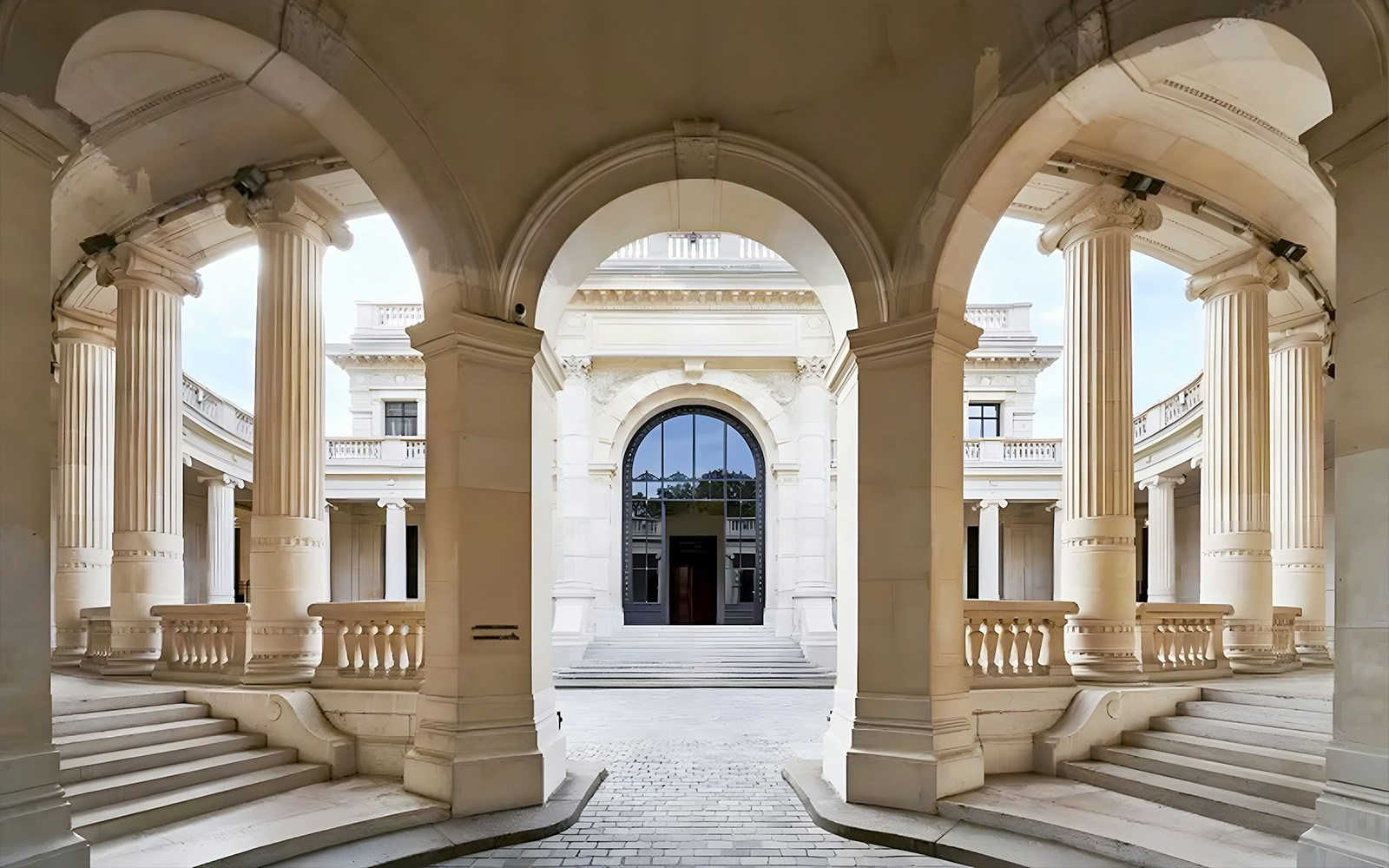 Palais Galliera corridors with arched architecture and columns in Paris.